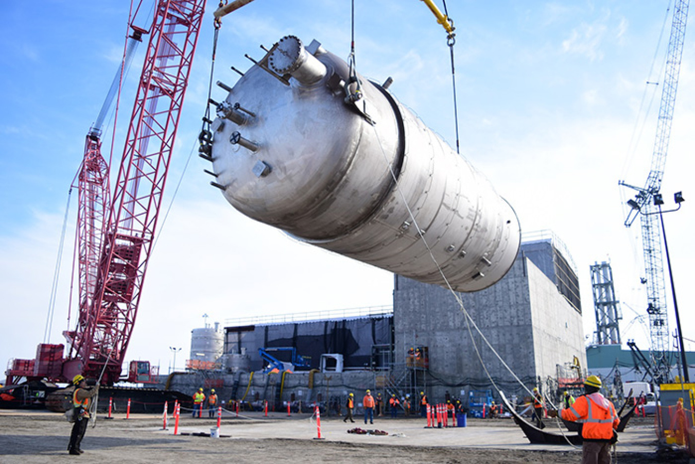 Mobile crane lifting a stainless steel vessel at the Harris Thermal fabrication facility